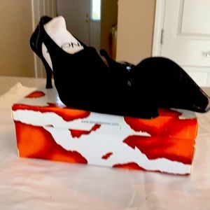 Black fabric, 3 “ heel. Never worn. Bag included